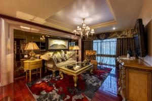 a living room with a couch and a table at Tuli Imperial in Nagpur
