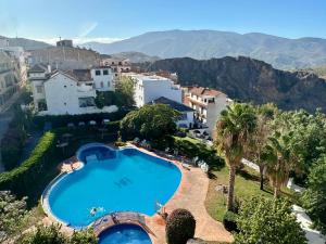 an aerial view of a resort with a swimming pool at Hotel Andalucia in Lanjarón