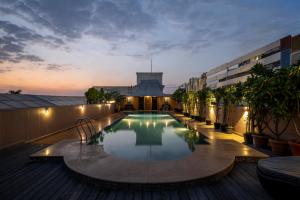 a swimming pool on the roof of a building at Tuli Imperial in Nagpur