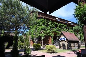a building with a train on top of it at Hotel-complex Mizh Triokh Ozer in Svityazʼ