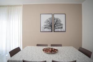 a dining room table with a bowl of food on it at A casa di Chiara in Lecce +48 photos