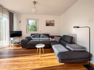 a living room with a couch and a table at Ferienhaus Caputh in Caputh