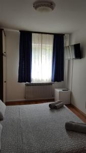 Postel nebo postele na pokoji v ubytování Guest House Jole