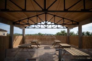 a group of picnic tables in a pavilion at Relais Terramare in Cellole