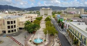 an aerial view of a city with buildings and a fountain at Casa-Museo centro de Caguas in Caguas