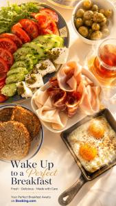 a table with plates of breakfast food on it at Каюта in Kotor