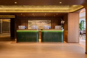 a lobby with a barbershop in a building at Barceló Roma in Rome +61 photos