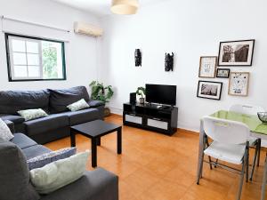 a living room with a couch and a table at Quinta da Ponte das Hortas 3 in Elvas