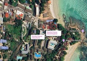 arial view of a house on a beach next to the water at Bhundhari Chaweng Beach Resort Koh Samui - SHA Plus in Chaweng