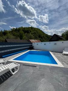 a swimming pool on the roof of a house at Pool House in Toplica +8 photos