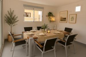 a dining room with a wooden table and chairs at Oramas Secret Cellar – Casa Rural in Arico