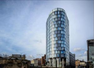 a tall glass building in a city with buildings at Central Sheffield Studio for 2 in Sheffield