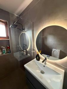 a bathroom with a sink and a mirror at The Canyon House in Çuadar +17 photos