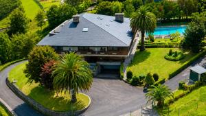 an aerial view of a house with a swimming pool at Hotel Arresi in Arminza