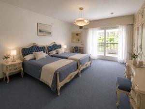 a large bedroom with two beds and a window at Hotel Arresi in Arminza +34 photos