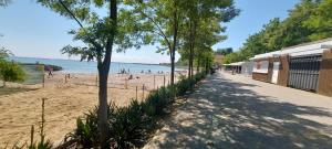 a beach with people playing on the sand at Уютная квартира в Одессе in Odesa