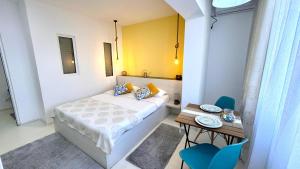 Un pat sau paturi într-o cameră la Angel Studio Central