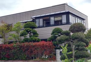 a large building with trees in front of it at Villa Nami in Kashima +31 photos