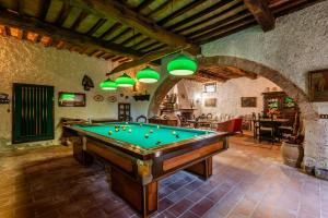 a room with a pool table in a building at Appartamento Nobile Murlo in Murlo