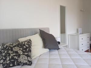 a bedroom with a bed with two pillows on it at Calice dei Cherubini in Montecalvo Versiggia