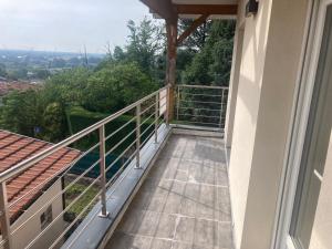 a balcony of a house with a view at Les Hauts de Bassens in Bassens