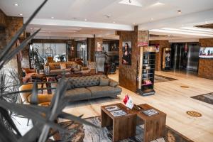 a lobby with a couch and tables in a store at Newway Otel in Kayseri