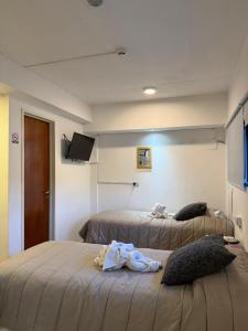 Una cama o camas en una habitación de MS Hotel Campos 26