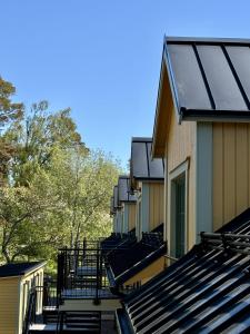 a row of solar panels on the side of a building at Lilla Hotellet Blidö in Blidö