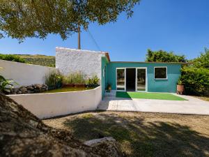 a green and white house with a yard at Quinta da Ponte das Hortas 1 in Elvas