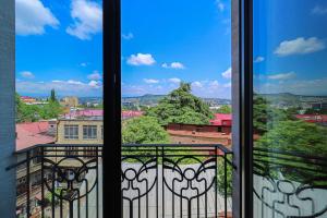 a view from a balcony with a view of a city at Spacious Sololaki 2BR with Balcony - by Wehost in Tbilisi City