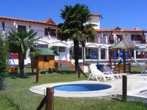 a resort with a playground and a swing set at COMPLEJO LLATANI in Los Reartes