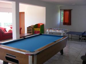 a living room with a pool table in it at COMPLEJO LLATANI in Los Reartes