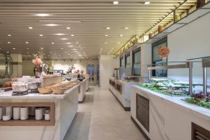 a restaurant with a buffet line with food at Sura Concept Hotel in Istanbul