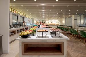 a kitchen with a counter with fruit on it at Sura Concept Hotel in Istanbul +27 photos