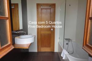 a bathroom with a sink and a tub and a toilet at First Balcony - Porto Santo in Porto Santo +32 photos