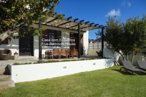 a building with a sign for a fireeland house at First Balcony - Porto Santo in Porto Santo