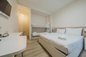 a bedroom with a bed and a bunk bed at Cristel Apartment - 15 min da Milano in Cormano +15 photos