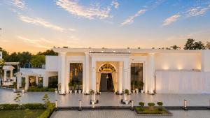 a large white building with a large entrance at White Wharf Manesar in Gurgaon