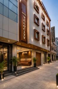 a facade of a hotel with plants in front of it at Hotel Velocity Near Terminal 3 Delhi International Airport With- Free Pickup in New Delhi