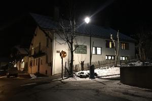 a building with a street light in front of it at night at Chalet-Ski-Station in Chamonix