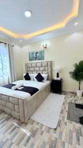 a bedroom with a large bed in a room at Serenity Elgon Stay in Eldoret