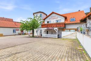 a cobblestone street in front of a building at Gasthaus Hirschkeller in Göppingen