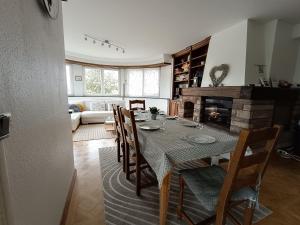 a dining room with a table and a fireplace at La Tour de l'Ill in Strasbourg +32 photos
