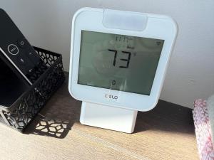 a clock sitting on top of a table at Pet-Friendly Private Beach Oceanfront Cottage in Charlestown
