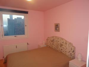 Letto o letti in una camera di Flat UNO City