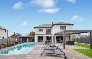 a house with a swimming pool and a patio at Villa Botero Dinard in Dinard +14 photos