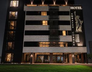 a hotel is lit up at night at Aw Hotel Embassy Corner - Corferias, Embajada EEUU & Vive Claro in Bogotá