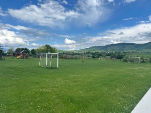 a field with a soccer goal in the grass at V&V Hotel in Gyulagarak