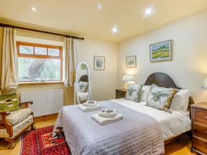 a bedroom with a bed with two towels on it at Seaton Court - Uk31955 in Staithes