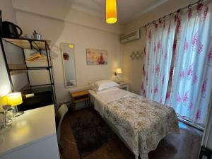 a small bedroom with a bed in a room at Zoe Pension in Ermioni +55 photos